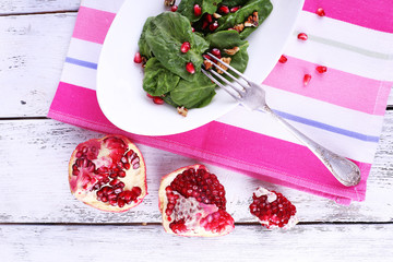 Fresh salad with greens, garnet and spices