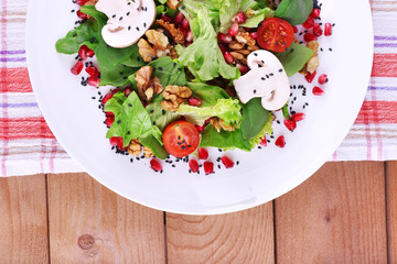 Fresh salad with greens, garnet and spices