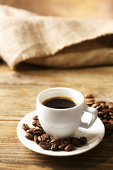 Cup of coffee on wooden table