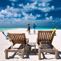 Couple running on a beach at Maldives