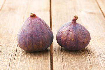 Fresh figs on wooden table