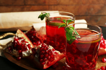 Pomegranate drink in glasses with mint