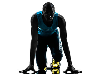 man runner sprinter on starting blocks   silhouette