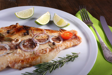 Dish of Pangasius fillet with spices and vegetables