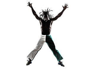 Fototapeta na wymiar Brazilian black man jumping arms outstretched silhouette
