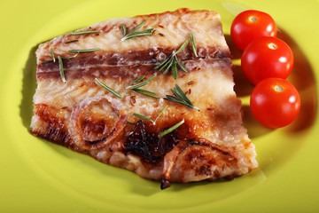 Dish of Pangasius fillet with rosemary and cherry tomatoes