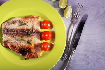 Dish of Pangasius fillet with rosemary and cherry tomatoes in