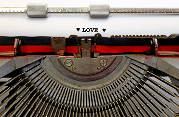 written typewriter LOVE with black ink