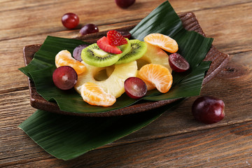 Fruit dessert on green leaf on table