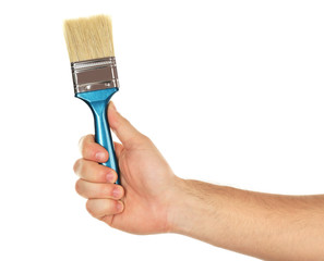 Paintbrush in male hand isolated on white