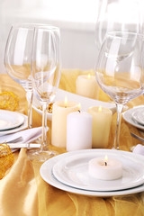 Beautiful holiday table setting in white and gold color