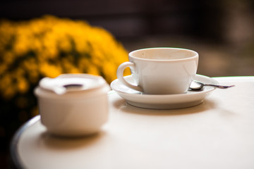 Teapot and cup in a cafe