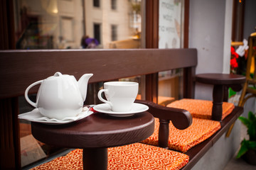 Teapot and cup in a cafe