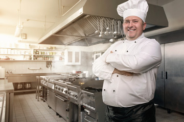 Portrait of a happy chef in his kingdom