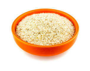 Healthy psyllium husks in bowl on white