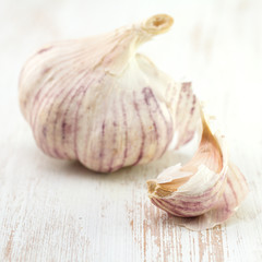 garlic on white wooden background