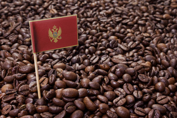 Flag of Montenegro sticking in coffee beans.(series)
