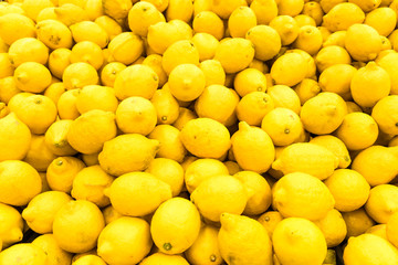 Colorful Display Of Lemons In Fruit Market