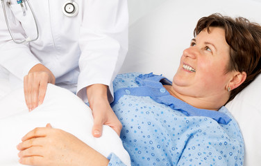 Nurse helping to senior patient at home