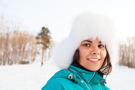 Attractive young female on a ski resort close-up