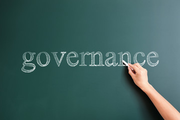 governance written on blackboard