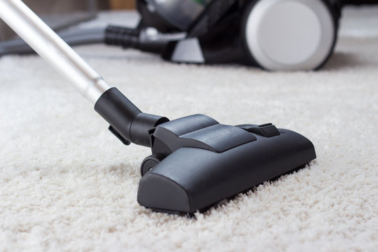 Vacuuming A Thick Pile White Carpet