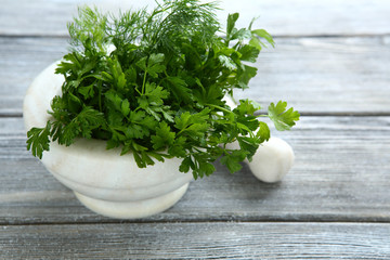 Parsley and dill in a mortar