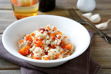 rice with fried carrots in a white bowl
