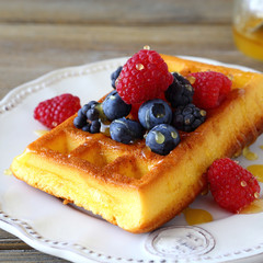Homemade waffles with raspberries, blackberries, blueberries