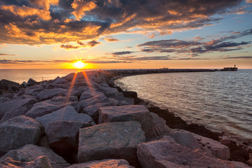 Sunset over breakwater