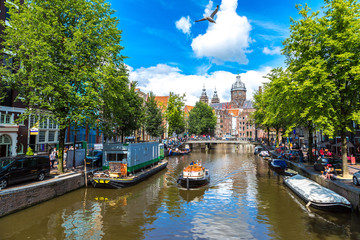 Naklejka premium Canal and St. Nicolas Church in Amsterdam