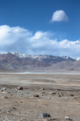 The valley at the foot of the mountains on Pamir. Spring. Tajiki