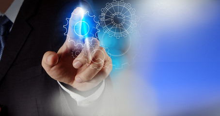 businessman hand draws gear to success concept