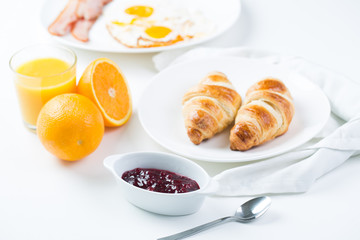 delicious breakfast with croissants and juice