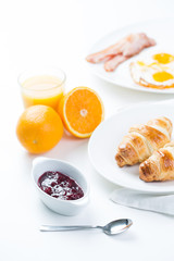 delicious breakfast with croissants and juice