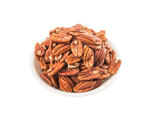 Pecan nut in a white bowl over white background
