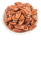 Pecan nut in a white bowl over white background