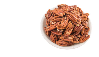 Pecan nut in a white bowl over white background