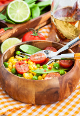 Fresh salad with corn, peas, tomato and chilli