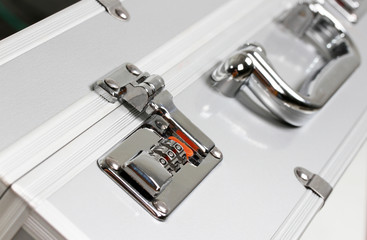 Metallic suitcase with safety code