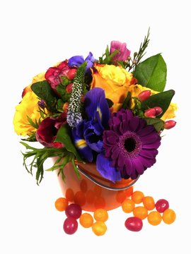 A flower arrangement with brightly colored flowers