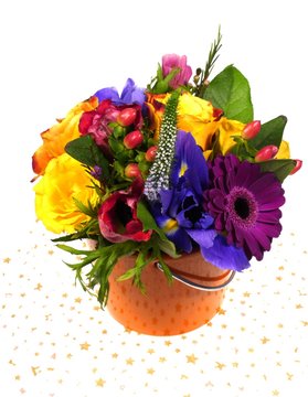 A flower arrangement with brightly colored flowers