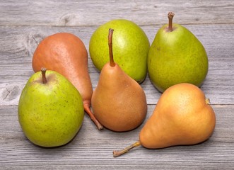 Pears isolated on wooden background
