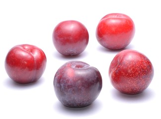 Ripe plums fruit isolated on white background