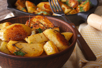 Tasty hot baked potatoes in a bowl close-up horizontal
