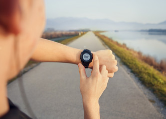 Runner start his watch before jogging