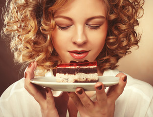 beautiful smiling young woman with a cake