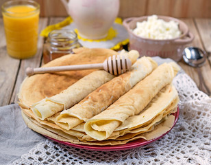 Homemade pancakes with honey and orange juice