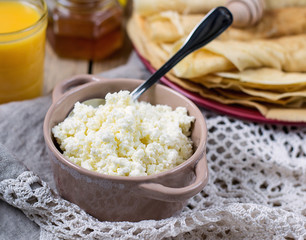 Homemade cottage cheese with orange juice and pancakes