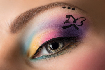 Woman eye with colorful make-up.